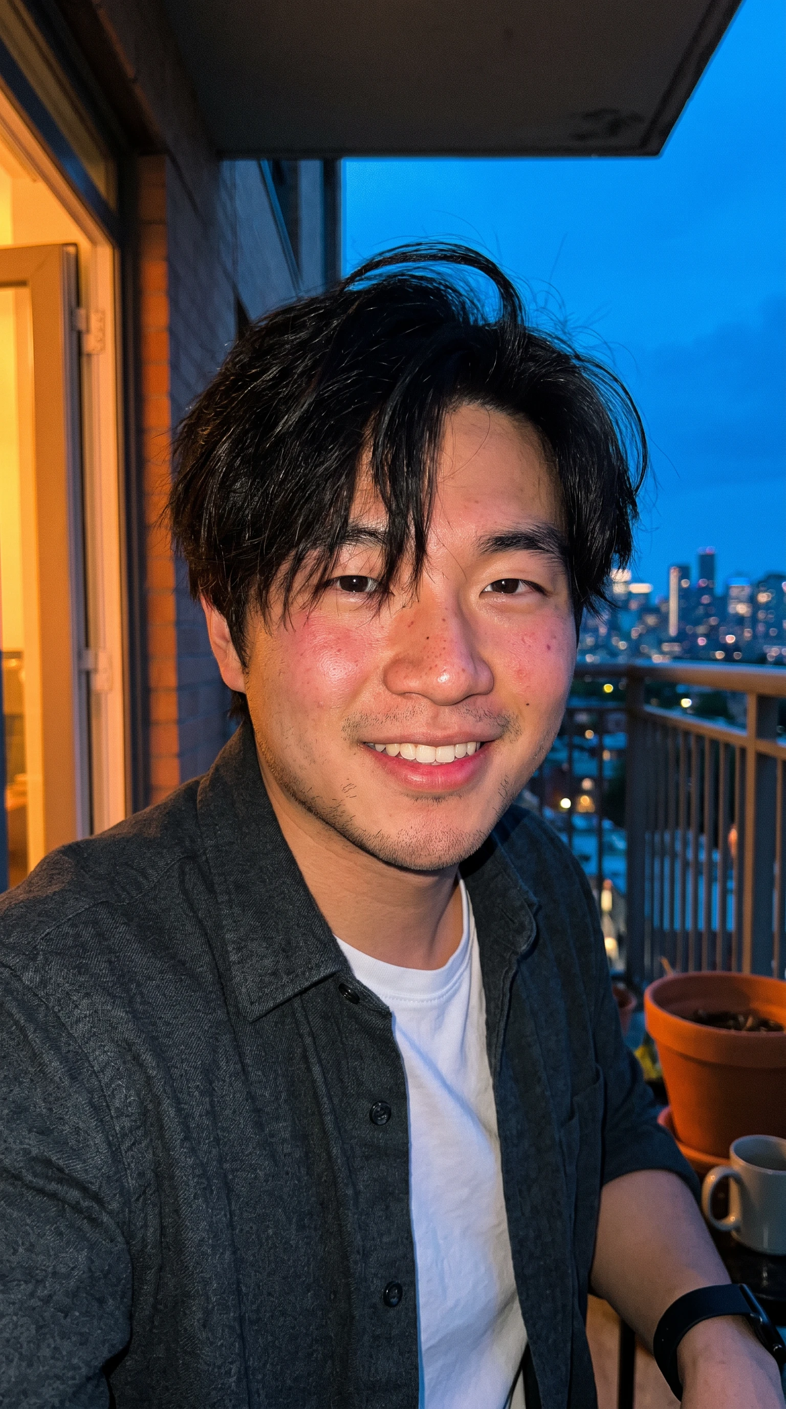 AI talking-avatar creator on a city balcony at dusk